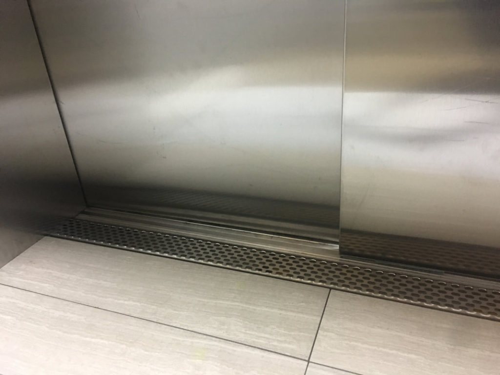 Integrated Elevator Sill Drains